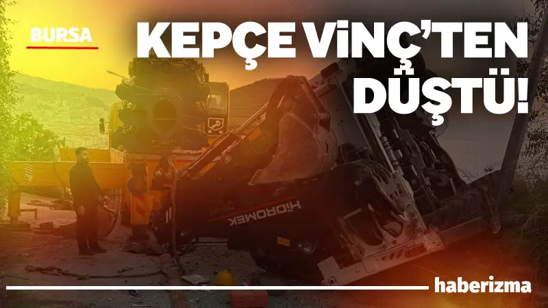 Bursa’da vinçten düşerek maddi hasar gören iş makinesinin düşme anına