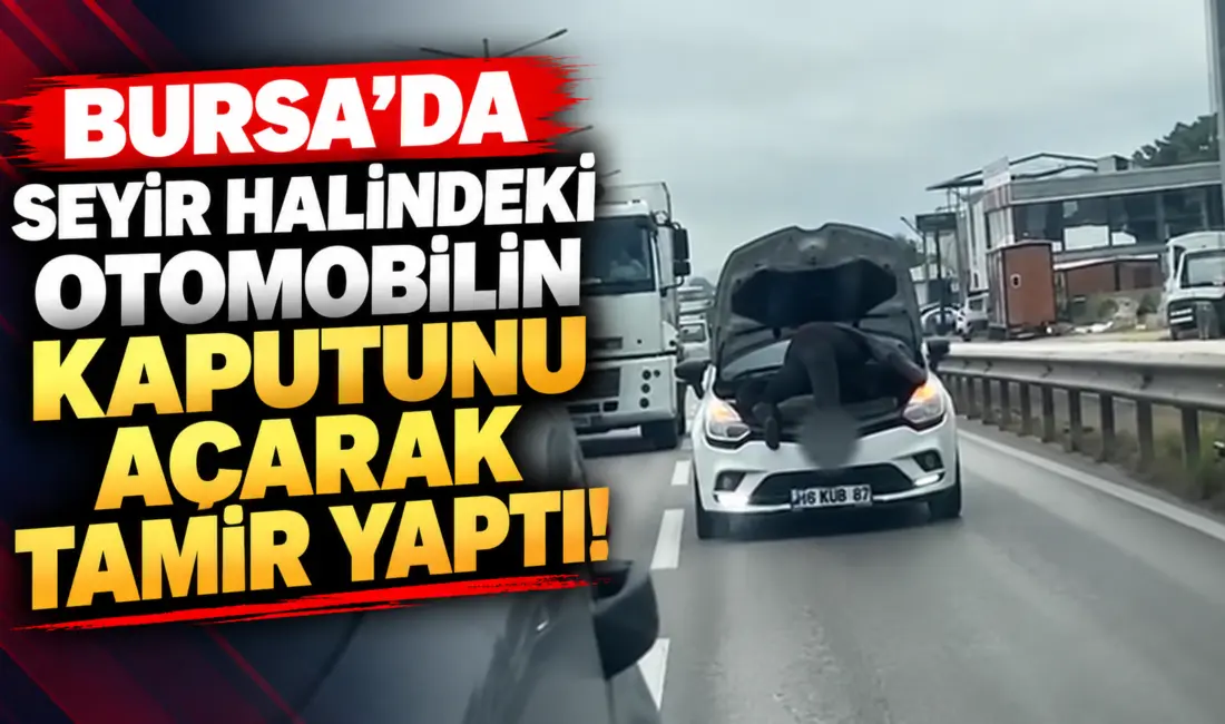 Bursa’da bir tamircinin, seyir halindeki otomobilin kaputunu açarak araç üzerinde