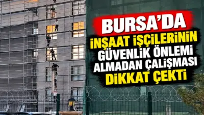 Bursa’da bir binanın dış cephesinde çalışma yapan işçilerin, yeterli güvenlik