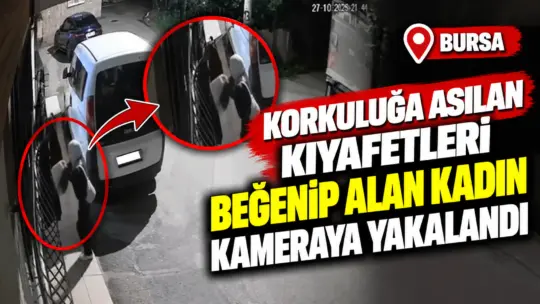 Bursa’da bir kadın, evin penceresinde kurutmak üzere asılı olan kıyafetleri